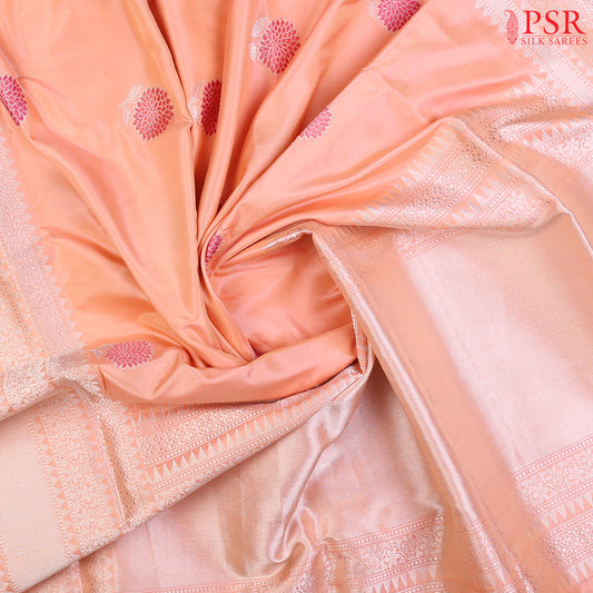 Discover the timeless charm of our Melon Peach Banarasi Katan Silk Saree, paired gracefully with a soothing Light Pink combination.