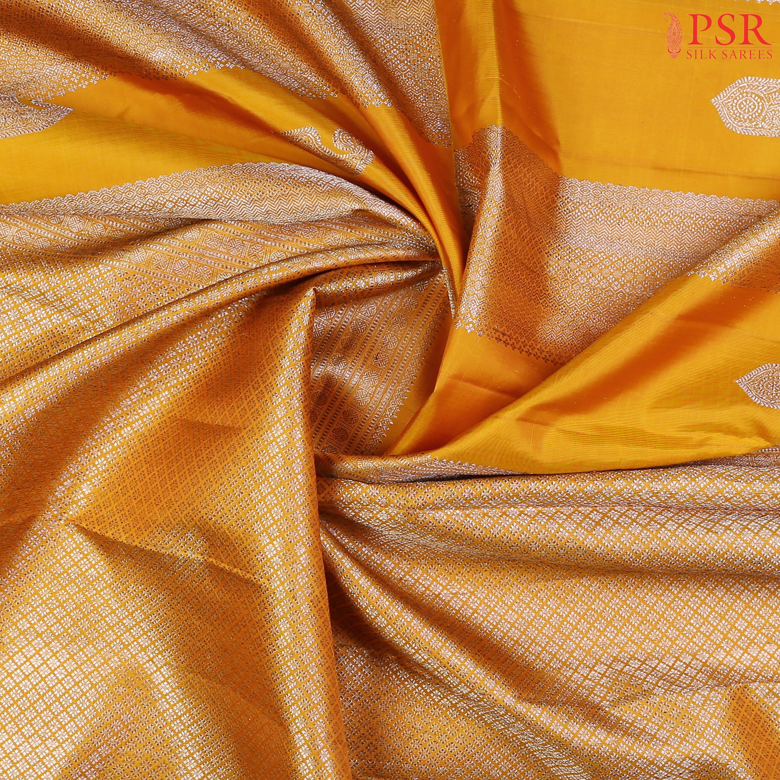 This Mustard Yellow Kanchipuram Silk Saree from PSR Silk Sarees is a radiant masterpiece from the "Shrestha Kanjivaram" collection