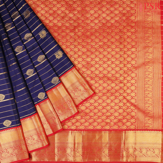 PSR Silks presents a Navy Blue Fancy Kanchipuram Silk Saree, elegantly paired with a striking Red combination. A timeless blend of tradition and grace!