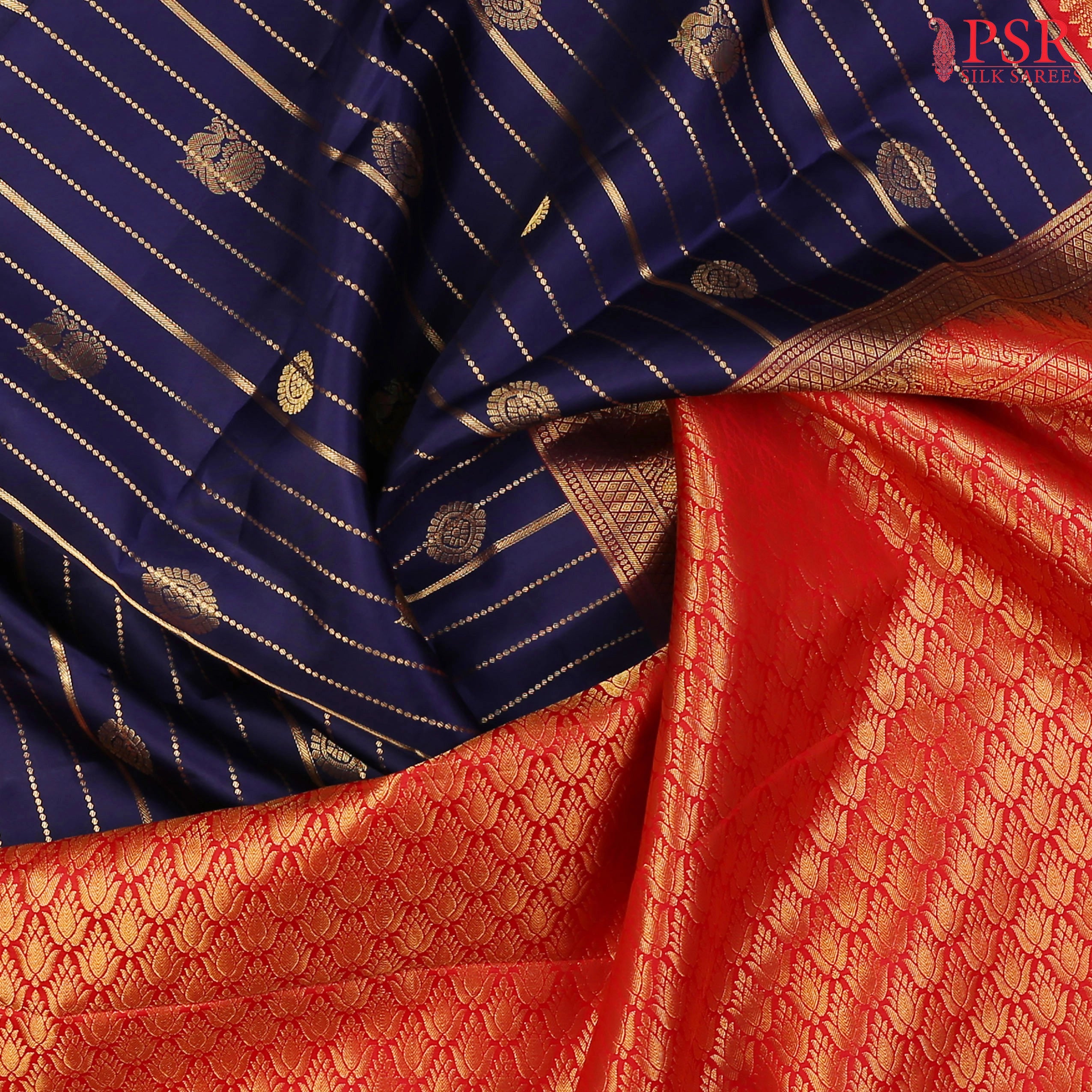 PSR Silks presents a Navy Blue Fancy Kanchipuram Silk Saree, elegantly paired with a striking Red combination. A timeless blend of tradition and grace!