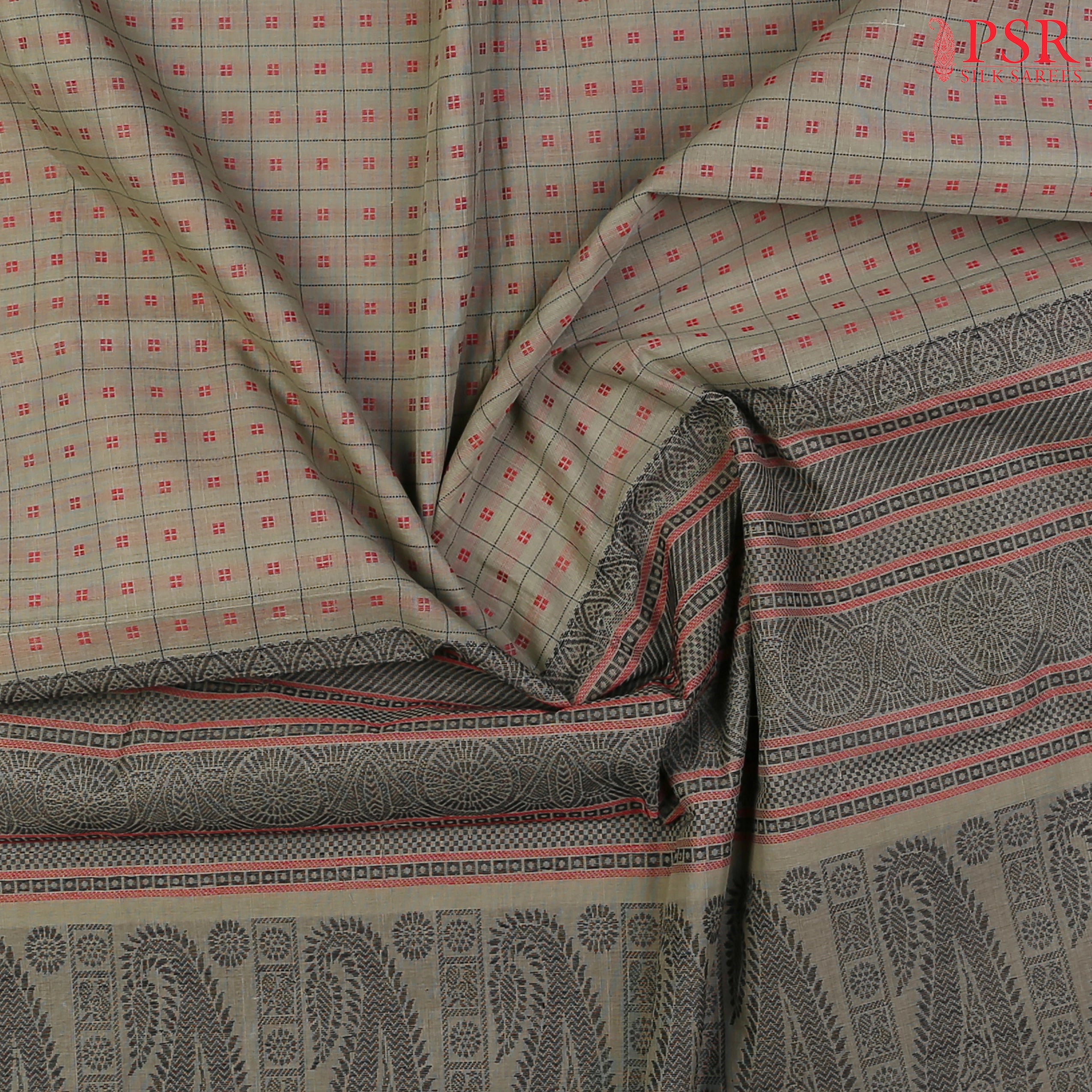 PSR Silks presents a traditional handloom Kalakshetra Kovai Cotton saree in a captivating Olive Khaki beautifully weaved with Red & black thread work.