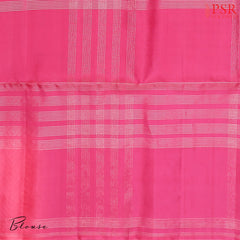 Drape yourself in contemporary grace with our Olive Mist Soft Silk Saree, beautifully contrasted with a vibrant Pink hue.