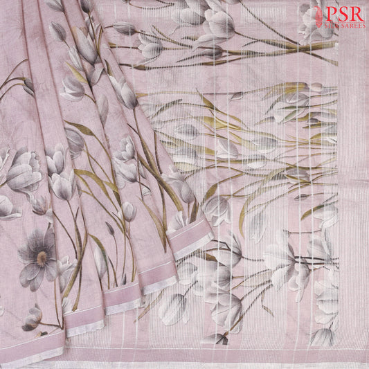 Pastel Mauve Linen Saree featuring delicate floral prints, a floral printed pallu with tissue stripes, and a matching floral printed blouse.