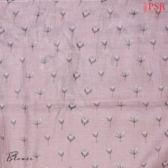 Pastel Mauve Linen Saree featuring delicate floral prints, a floral printed pallu with tissue stripes, and a matching floral printed blouse.