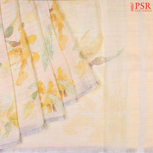 Peach Yellow Pure Linen Saree with floral prints, zari stripe pattern, a printed pallu with tissue stripes, and a matching printed blouse.