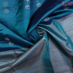  Drape yourself in the majestic charm of our Peacock Blue Soft Silk Saree, a celebration of tradition and beauty. 