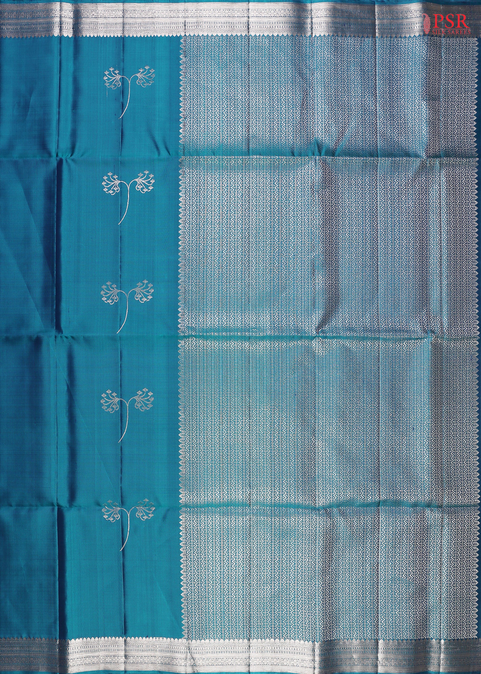  Drape yourself in the majestic charm of our Peacock Blue Soft Silk Saree, a celebration of tradition and beauty. 