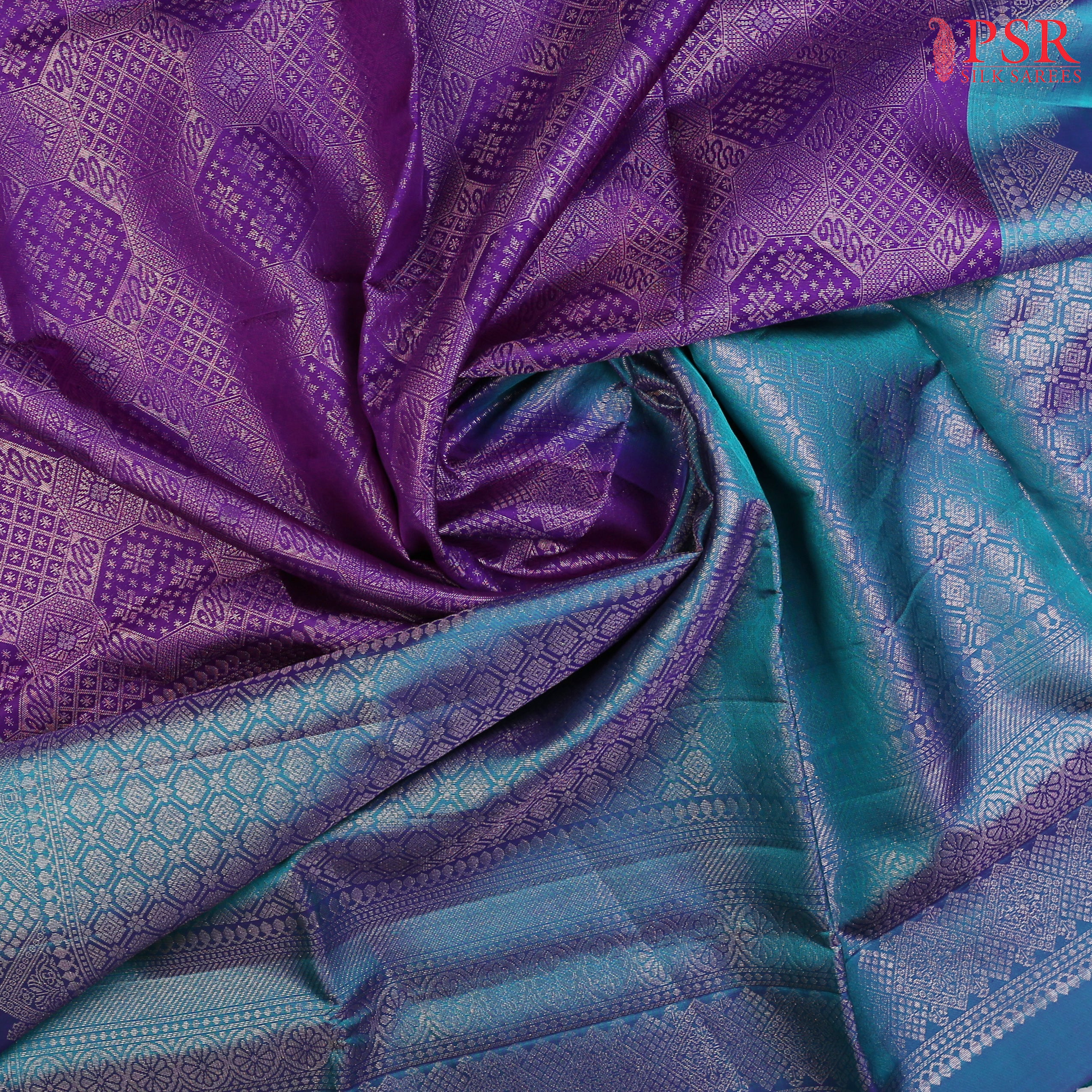 Embrace elegance with our Rebecca Purple&nbsp;Soft Silk Saree, exquisitely paired with a&nbsp;Peacock Blue contrast.