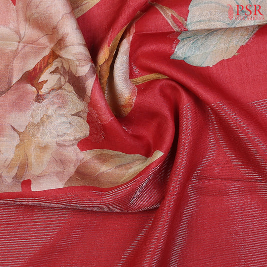 Red Kadhi Tussar Silk Saree featuring colorful floral prints, silver zari paisley motifs, a matching silver zari striped pallu, and a plain blouse—perfect for festive elegance.