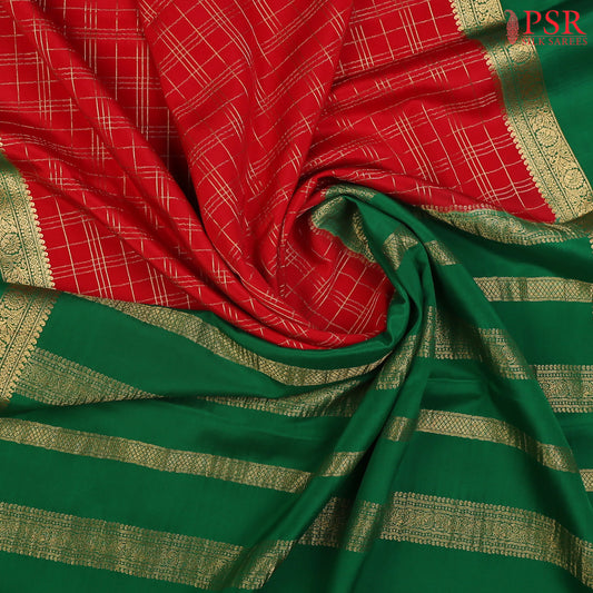 PSR Silks presents a Red colored Mysore Silk saree with combination of Emerald Green color.