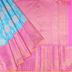 This stunning Sea Blue Summer & Fuchsia Pink Summer Kanchipuram Silk Saree crafted to perfection for brides who love a blend of tradition and charm