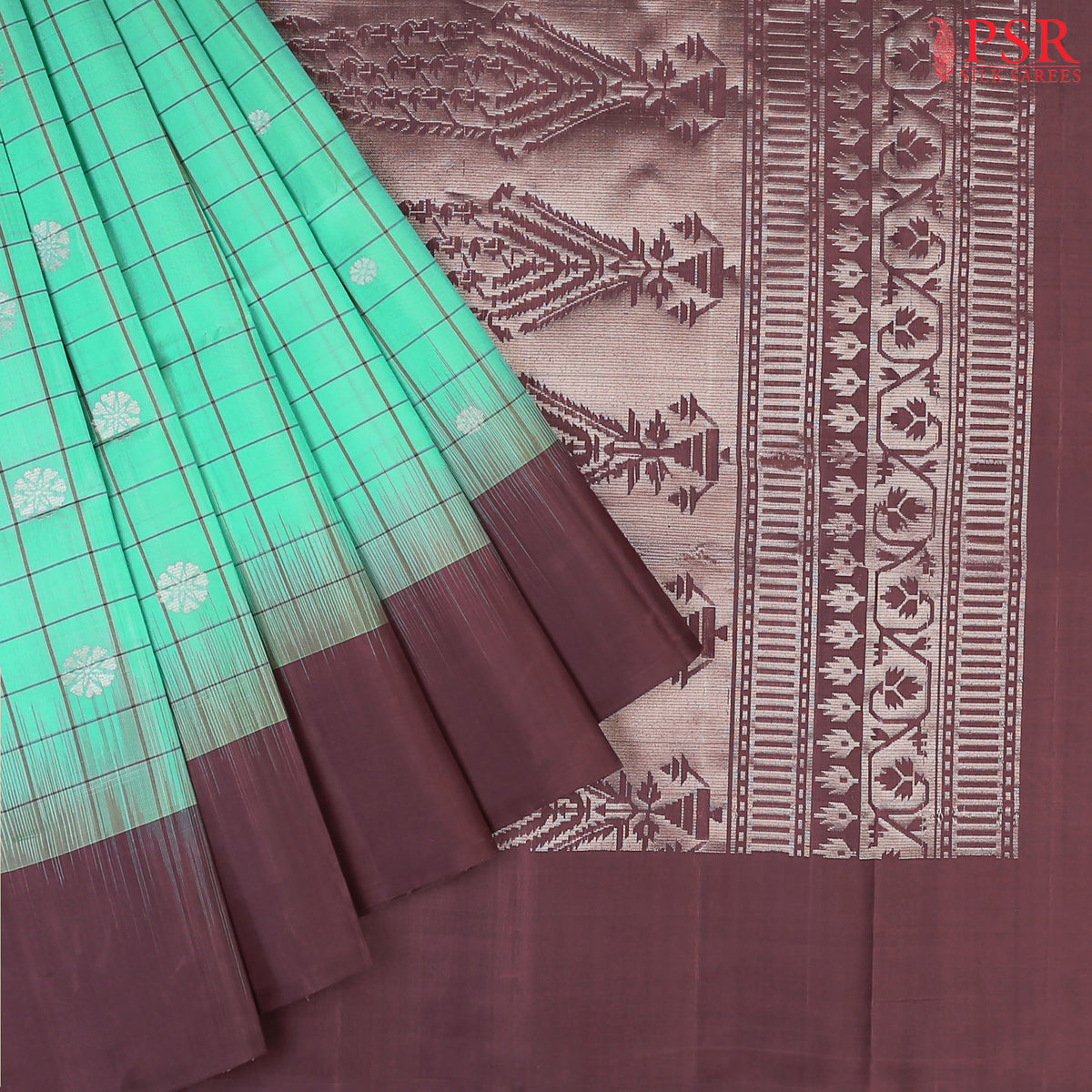 Embrace elegance with our Spring Green Soft Silk Saree, beautifully complemented by an Umber Brown combination. 