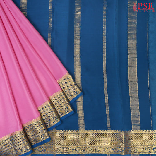 PSR Silks presents a Taffy Pink colored Mysore Silk saree with combination of Peacock Blue color.