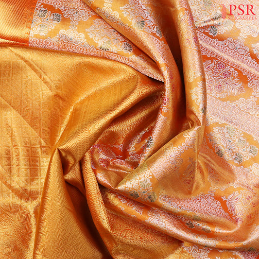 PSR Silk Sarees presents a stunning Tangerine Orange Kanchipuram Tissue Silk Saree, categorized under Bridal Kanchipuram