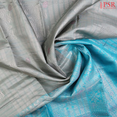 Drape yourself in contemporary grace with our&nbsp;Olive Mist Soft Silk Saree, beautifully contrasted with a&nbsp;vibrant Light Electric Blue hue.