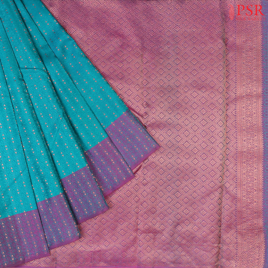 PSR Silks presents a Turquoise Cyan Fancy Kanchipuram Silk Saree, elegantly paired with a striking Purple combination. A timeless blend of tradition and grace