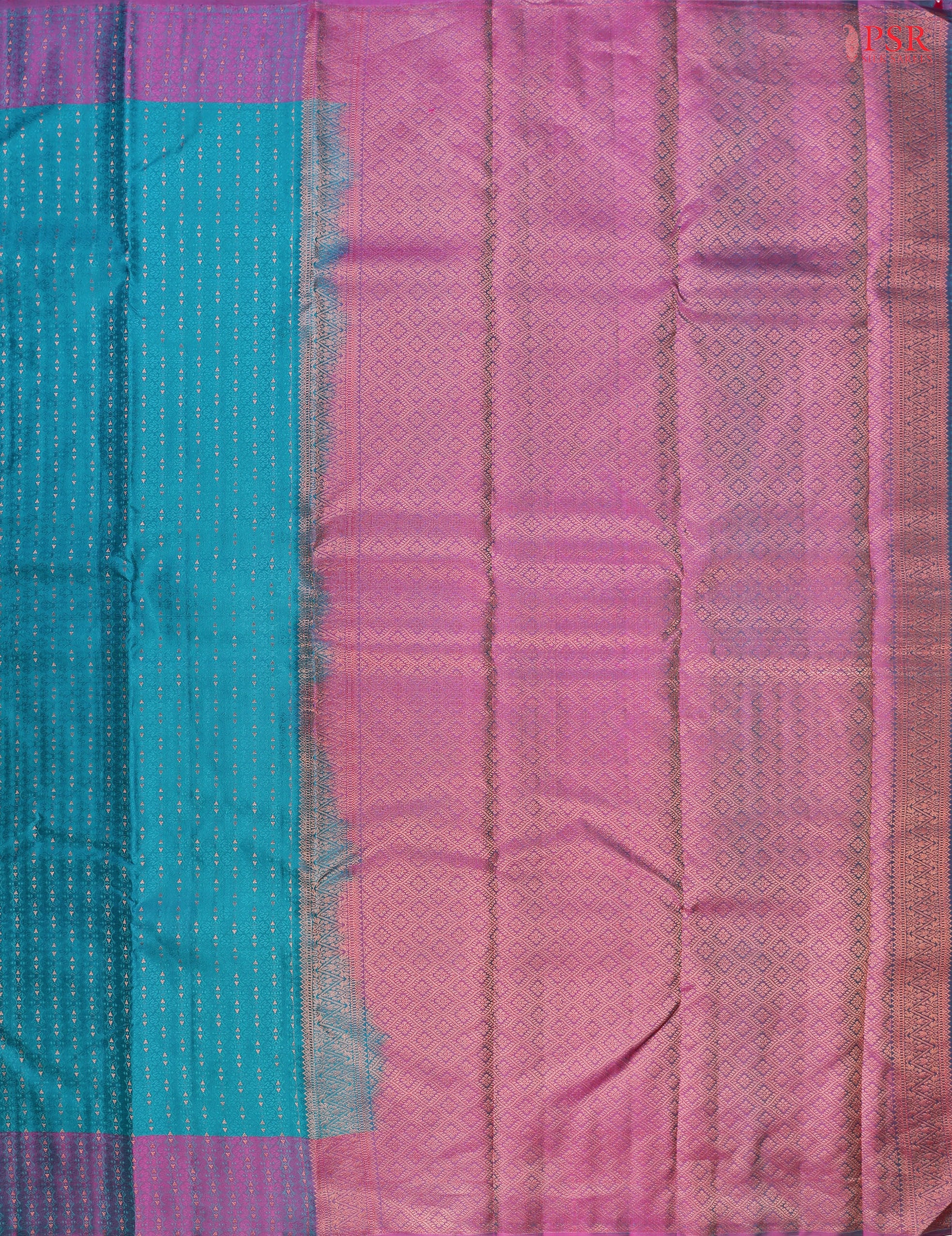 PSR Silks presents a Turquoise Cyan Fancy Kanchipuram Silk Saree, elegantly paired with a striking Purple combination. A timeless blend of tradition and grace