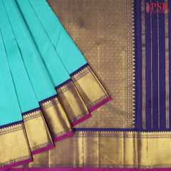 Turquoise Sea Green Kanchipuram Silk Saree with Traditional Zari Work Pallu & Border, Paired with a Plain Dark Blue Blouse – PSR Silks