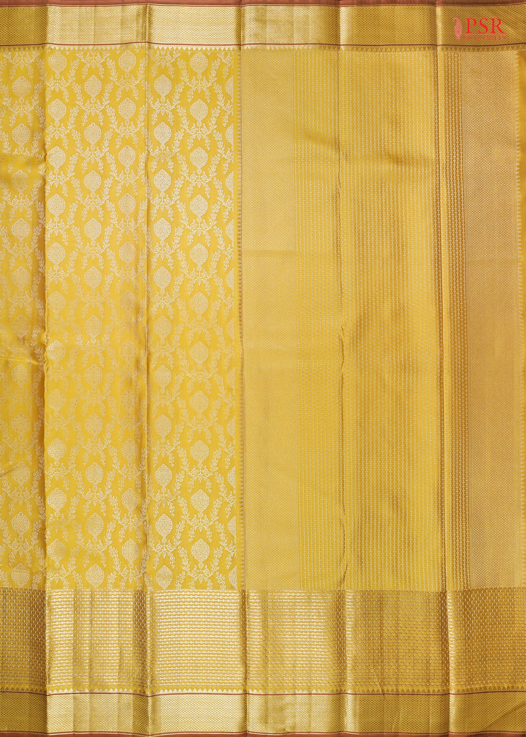 This Tuscan Yellow &amp; Brown Kanchipuram Silk Saree from PSR Silk Sarees is a timeless masterpiece from the "Vaichitrya Kanjivaram" collection