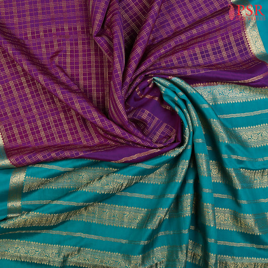 Step into elegance with PSR Silks' captivating Tyrian Purple Mysore Silk saree, paired with a striking Turquoise Cyan combination!