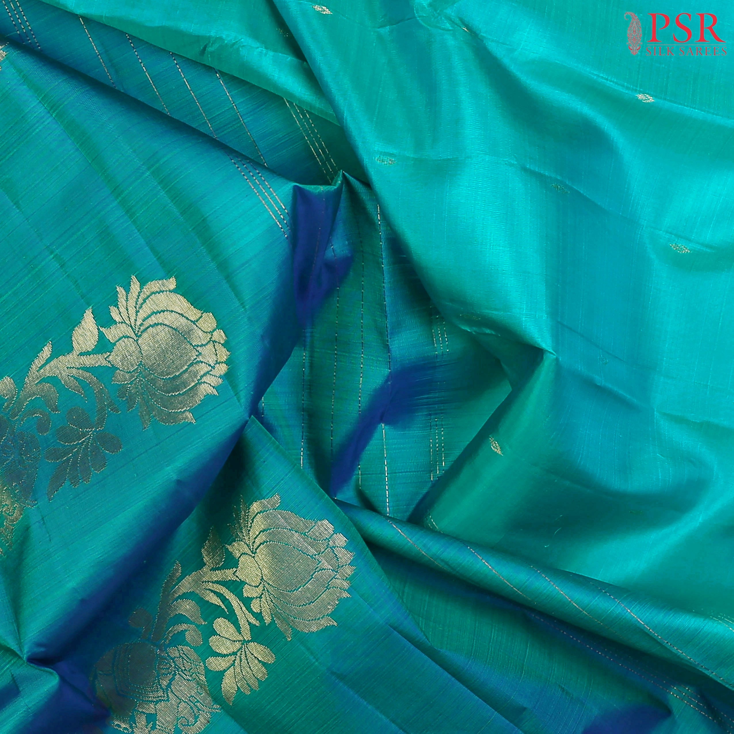 This Verdigris & Turquoise Blue Arani Silk Saree from PSR Silk Sarees is a refined blend of tradition and elegance