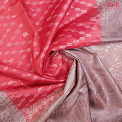 Drape yourself in the luxurious charm of our Vermilion Red Soft Silk Saree, beautifully complemented by a Mauve Blush combination. 