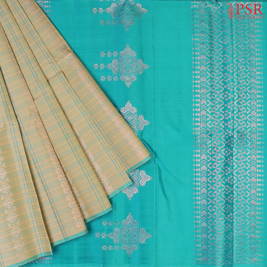 Step into refined luxury with our Wheat Beige Soft Silk Saree, exquisitely paired with a vibrant Turquoise contrast.