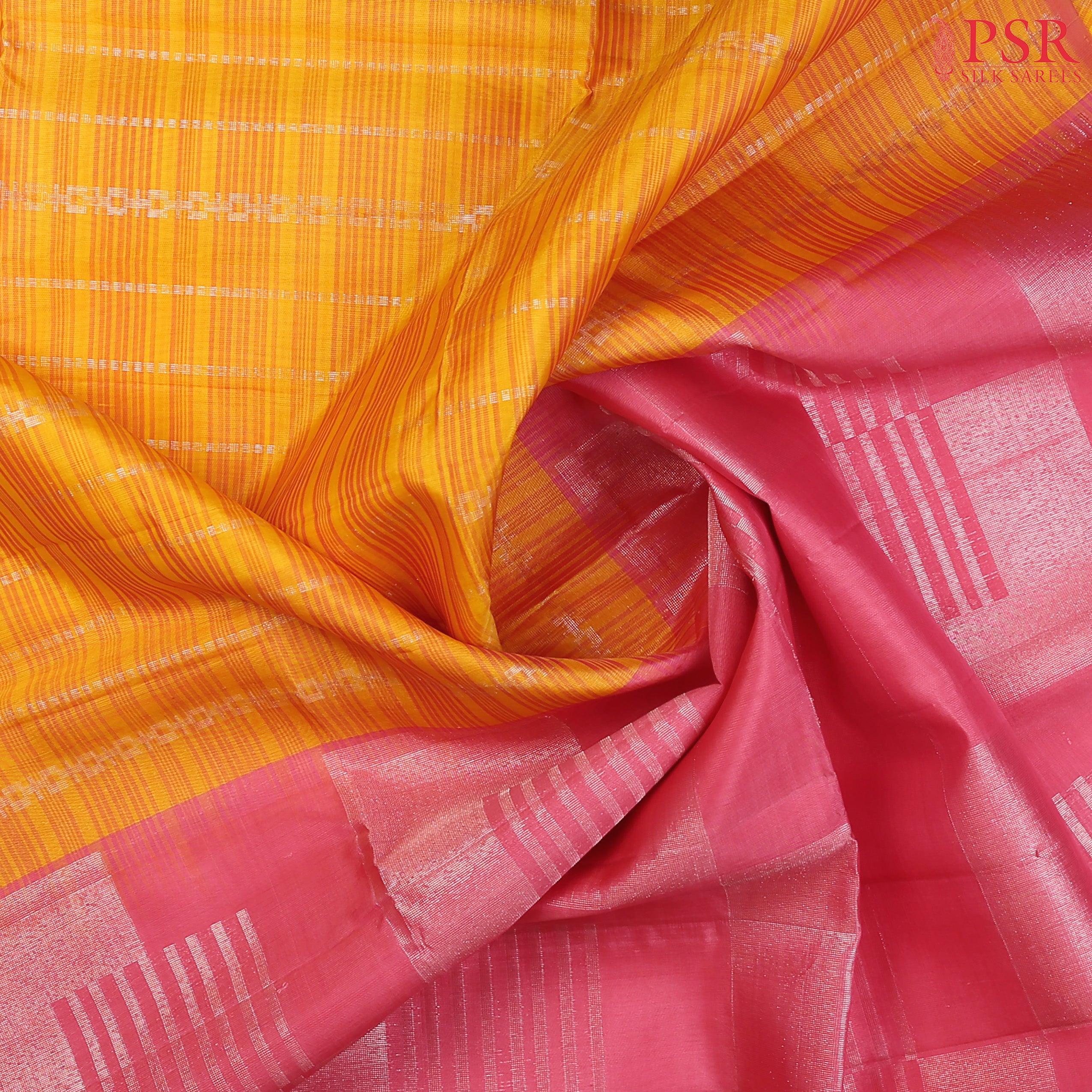 Indulge in the timeless beauty of our Yellow&nbsp;Kora Soft Silk Saree, gracefully paired with a Flamingo Pink contrast