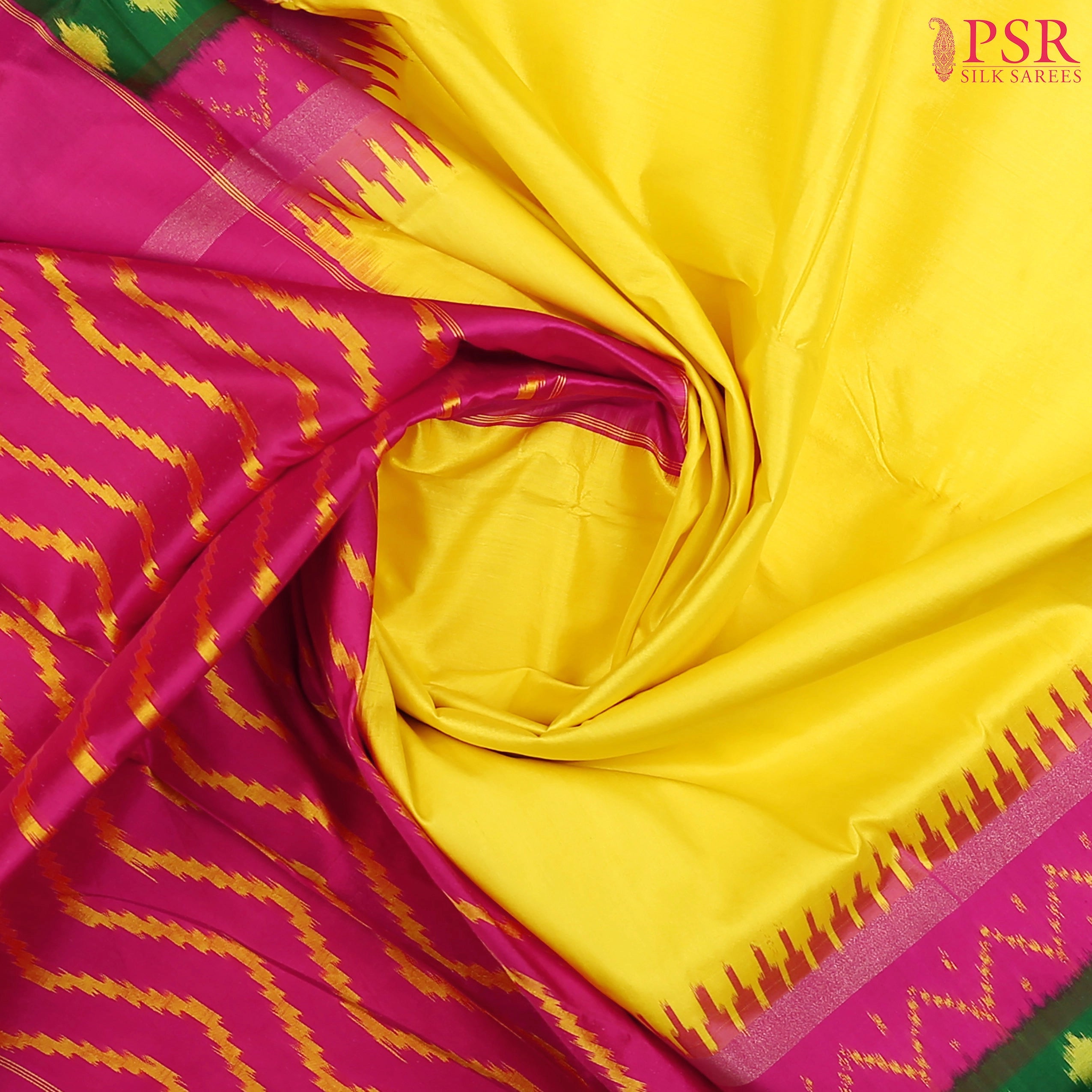 This Yellow &amp; Magenta Pink Pochampally Silk Saree from PSR Silk Sarees is a radiant blend of tradition and elegance.