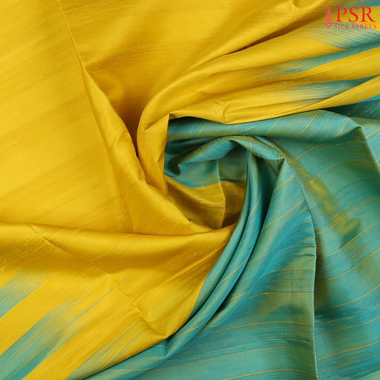 Wrap yourself in timeless sophistication with our Yellow Soft Silk Saree, exquisitely paired with a Turquoise Green combination. 